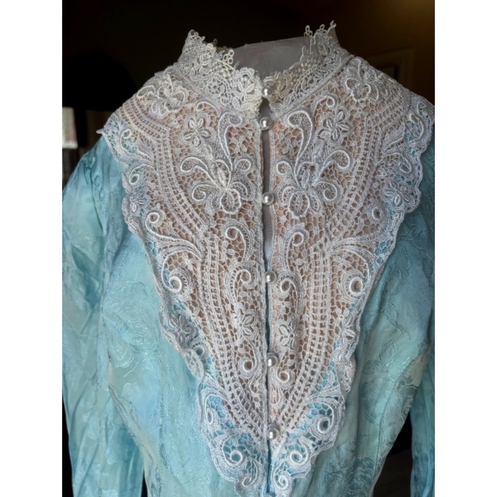 Antique Victorian button-down blouse made from blue satin jaquard fabric